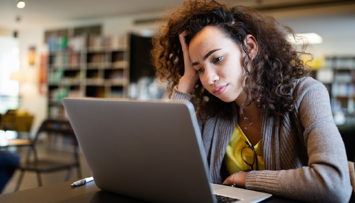 Woman with adult ADHD using laptop